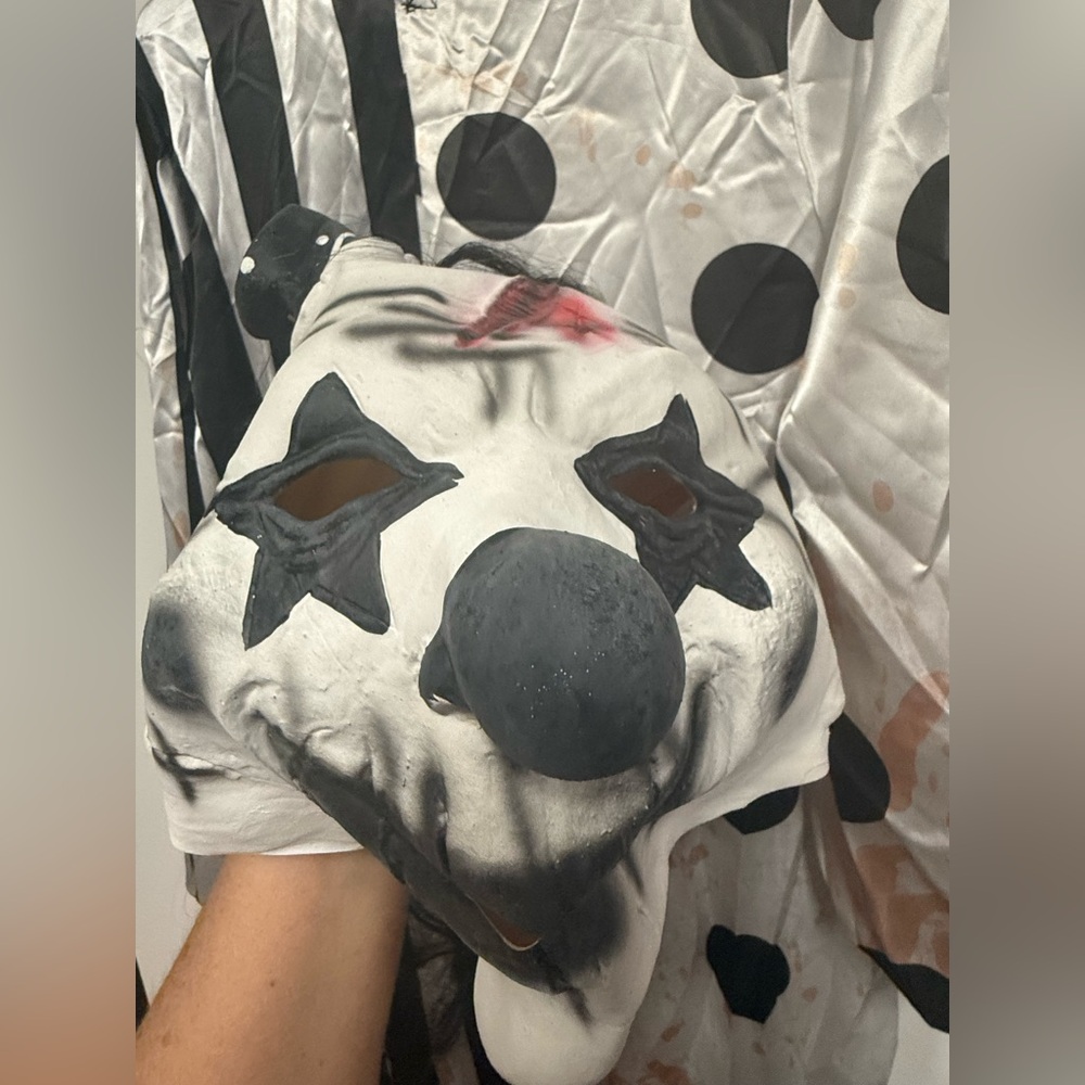 Creepy clown costume and mask.   Gory.  Scary. Halloween.